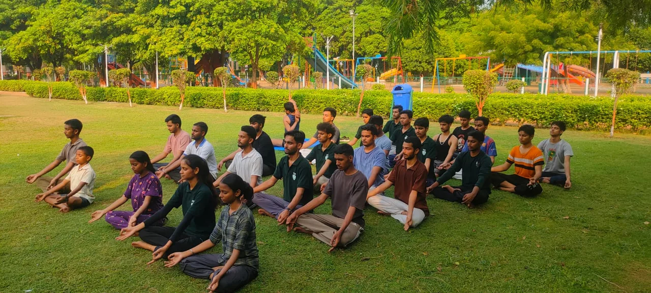 Students taking part in an outdoor meditation session